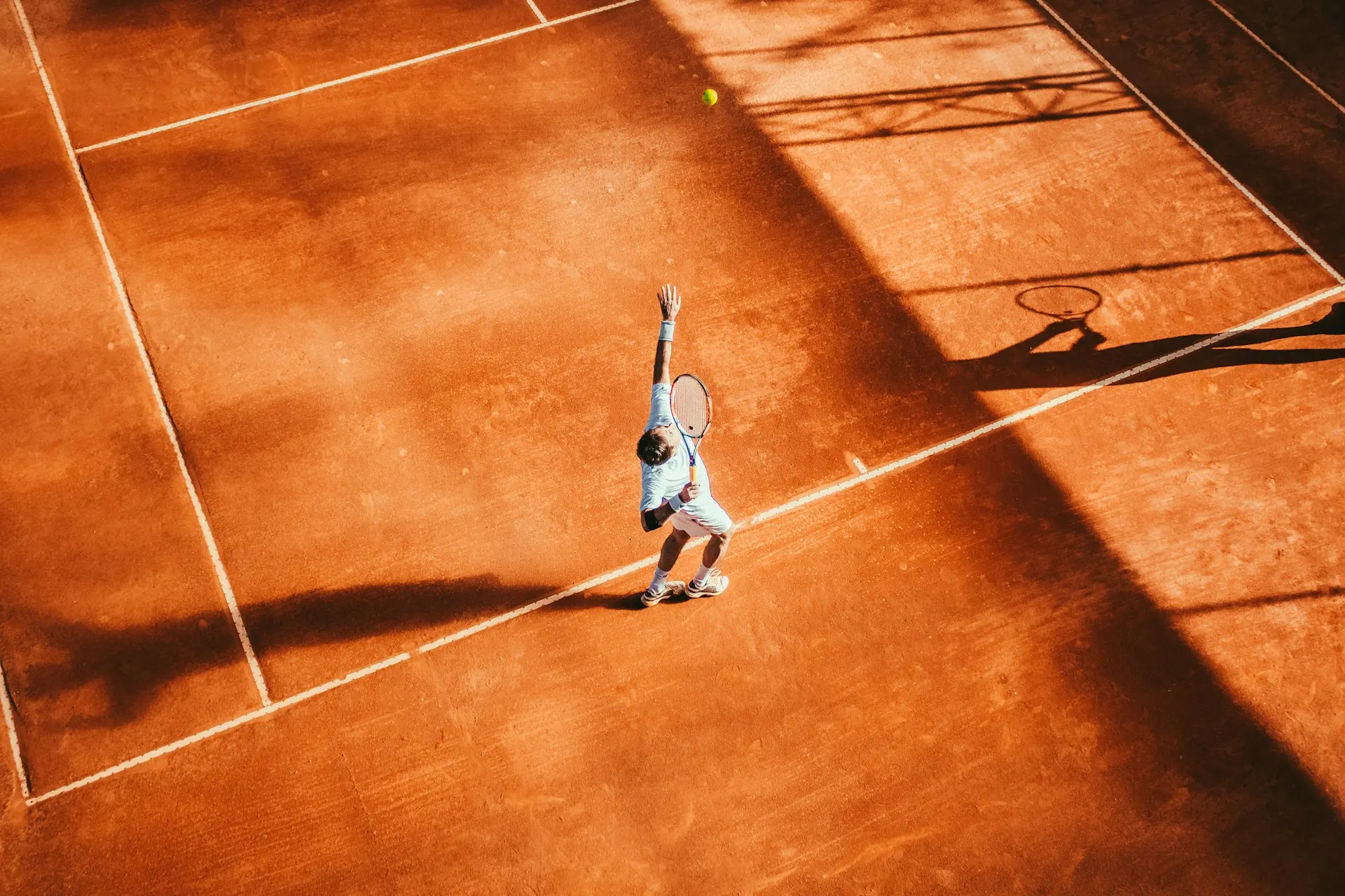 Indoor pickleball and tennis facility courts used by racquet sports coaches and clubs